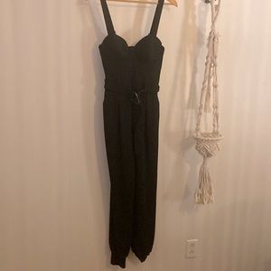 Guess romper Size SM, black in color